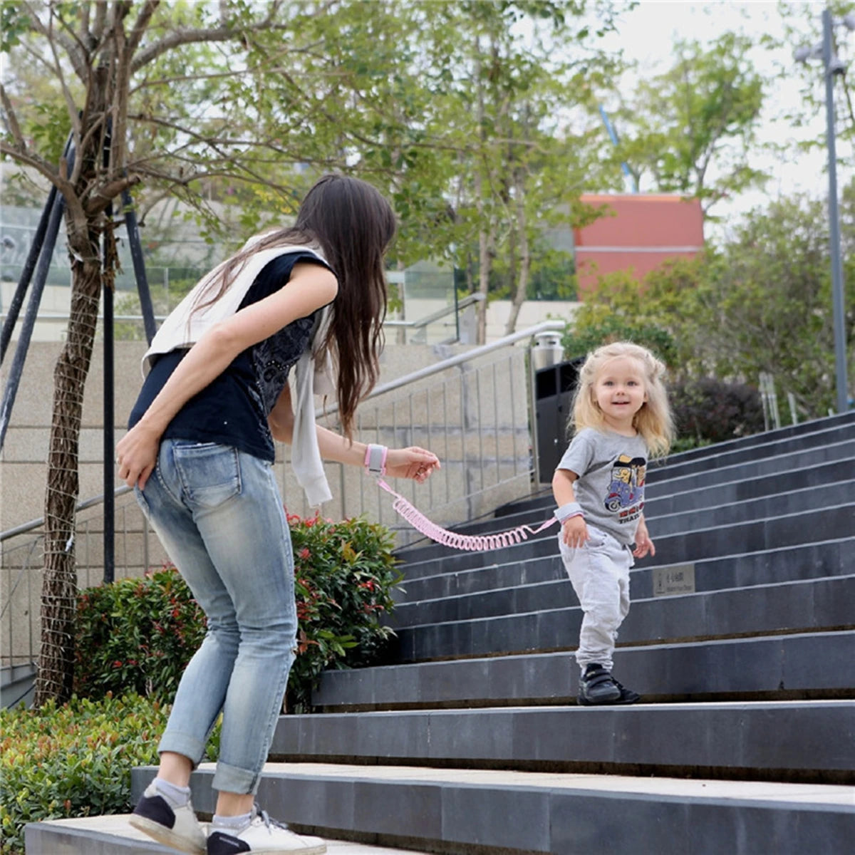 Child Safety Harness Leash helps keep toddlers and kids safe in crowded places. Adjustable wristband and traction rope design provides comfort, security, and anti-lost protection during travel, shopping, and outdoor activitie