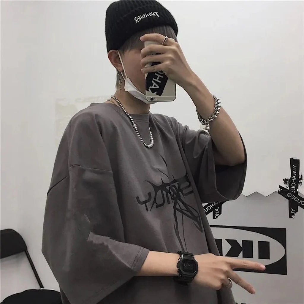 Men’s Gothic Skull T-Shirt features a stylish oversized streetwear design with dark anime and Y2K fashion vibes. Comfortable short sleeves and loose fit make it perfect for casual wear, summer outings, and everyday style